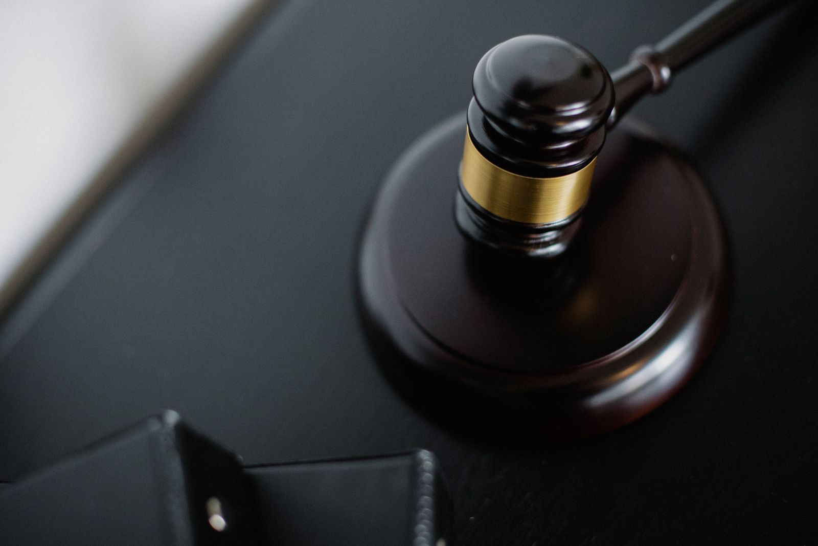 Georgia criminal defense attorney reviewing an assault and battery case file with a client