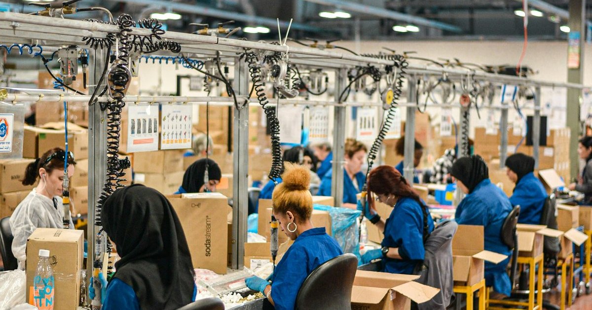 Stock photo of workers on a factory assembly line