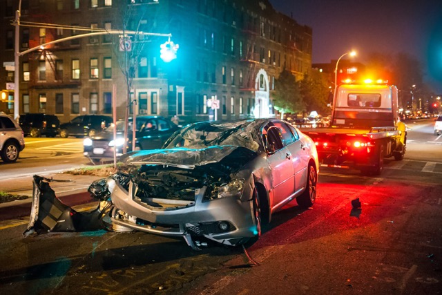 Stock photo of a firefighter working at the scene of a rollover crash